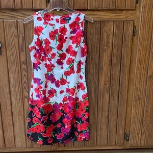Chaps Sleeveless Sheath Dress 
Designed with red poppy flowers 
Size 4